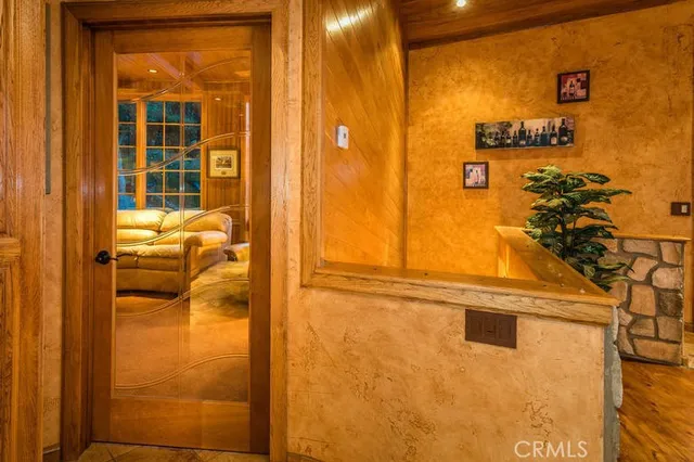 a living room with furniture a ceiling fan and a large window