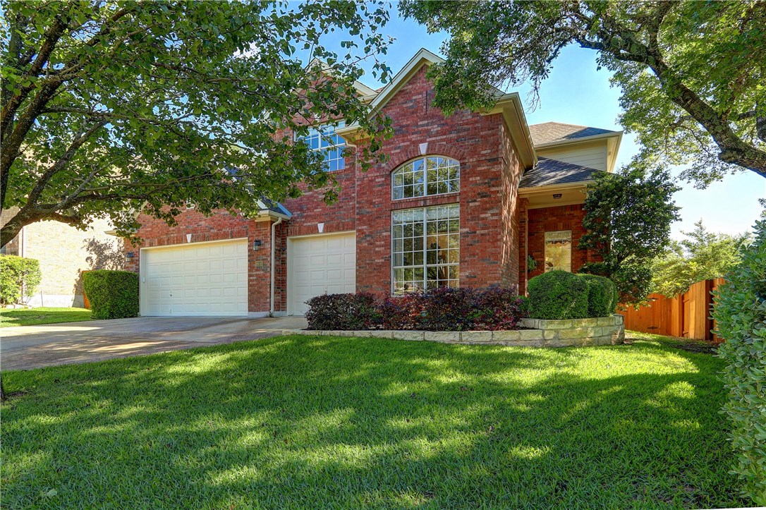 10648 Chestnut Ridge Road Austin, TX 78726 - Photo 1 of 1 front view of a house with a yard