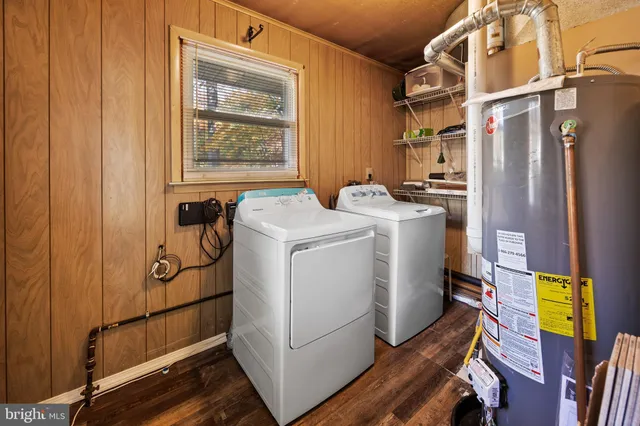 a view of a room with wooden floor and window