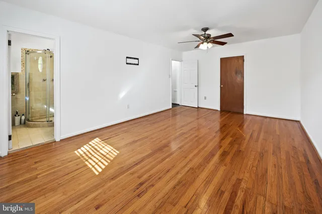 a bathroom with a sink toilet and mirror