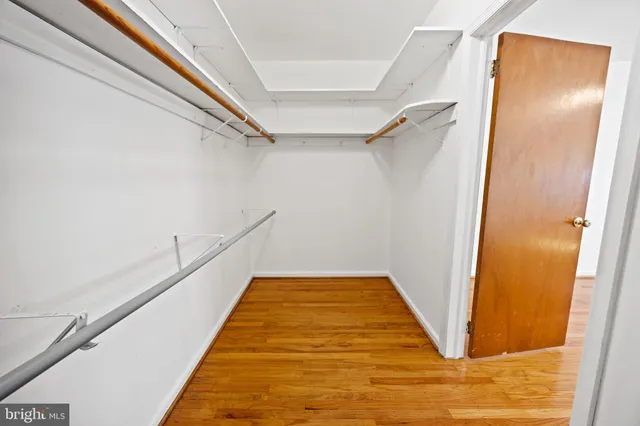a view of an empty room with a chandelier
