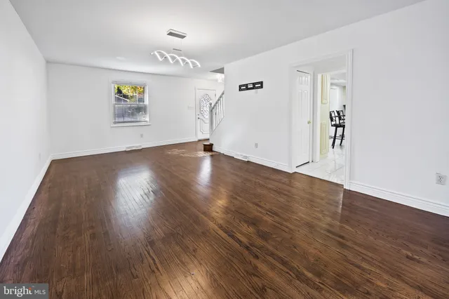 a kitchen with stainless steel appliances a stove a sink cabinets and a refrigerator