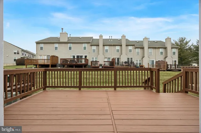 a view of a balcony with wooden fence