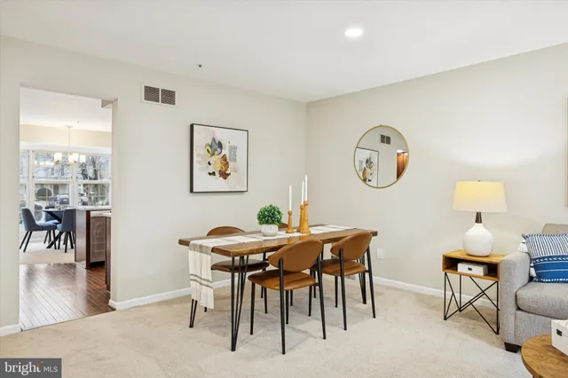 a view of a dining area with furniture and a large window