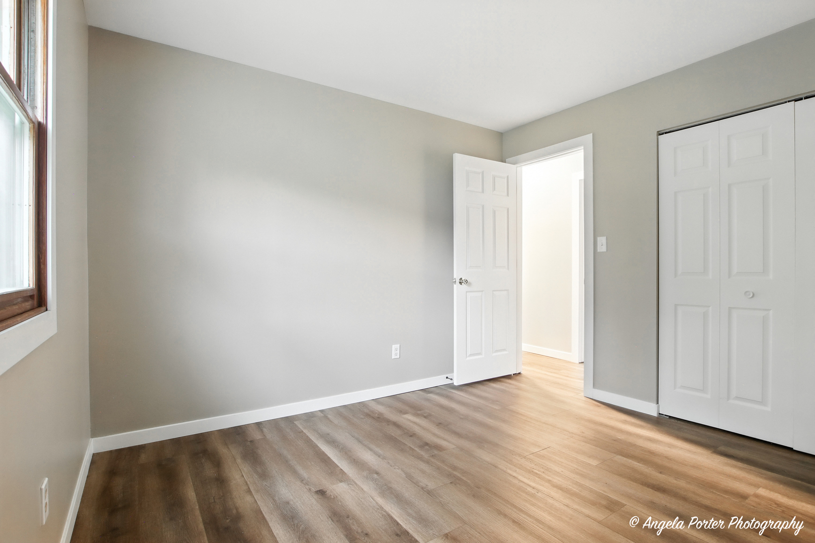4117 North Johnsburg Road Johnsburg, IL 60051 - Photo 14 of 25 an empty room with wooden floor and windows