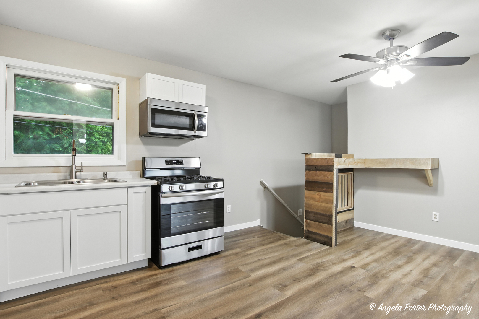 4117 North Johnsburg Road Johnsburg, IL 60051 - Photo 10 of 25 a kitchen with a stove and a sink