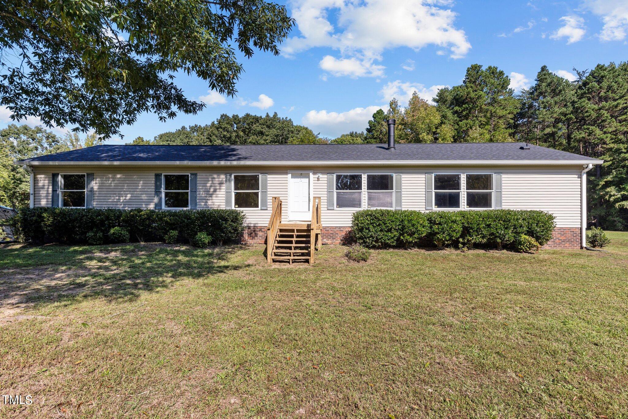 89 Munday Road Roxboro, NC 27574 - Photo 1 of 46 front view of a house with a yard