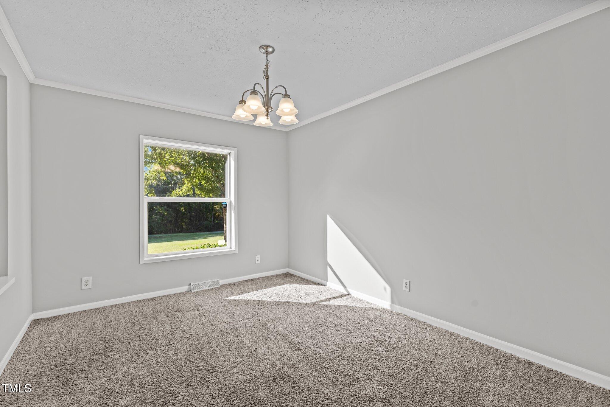 89 Munday Road Roxboro, NC 27574 - Photo 14 of 46 an empty room with a window