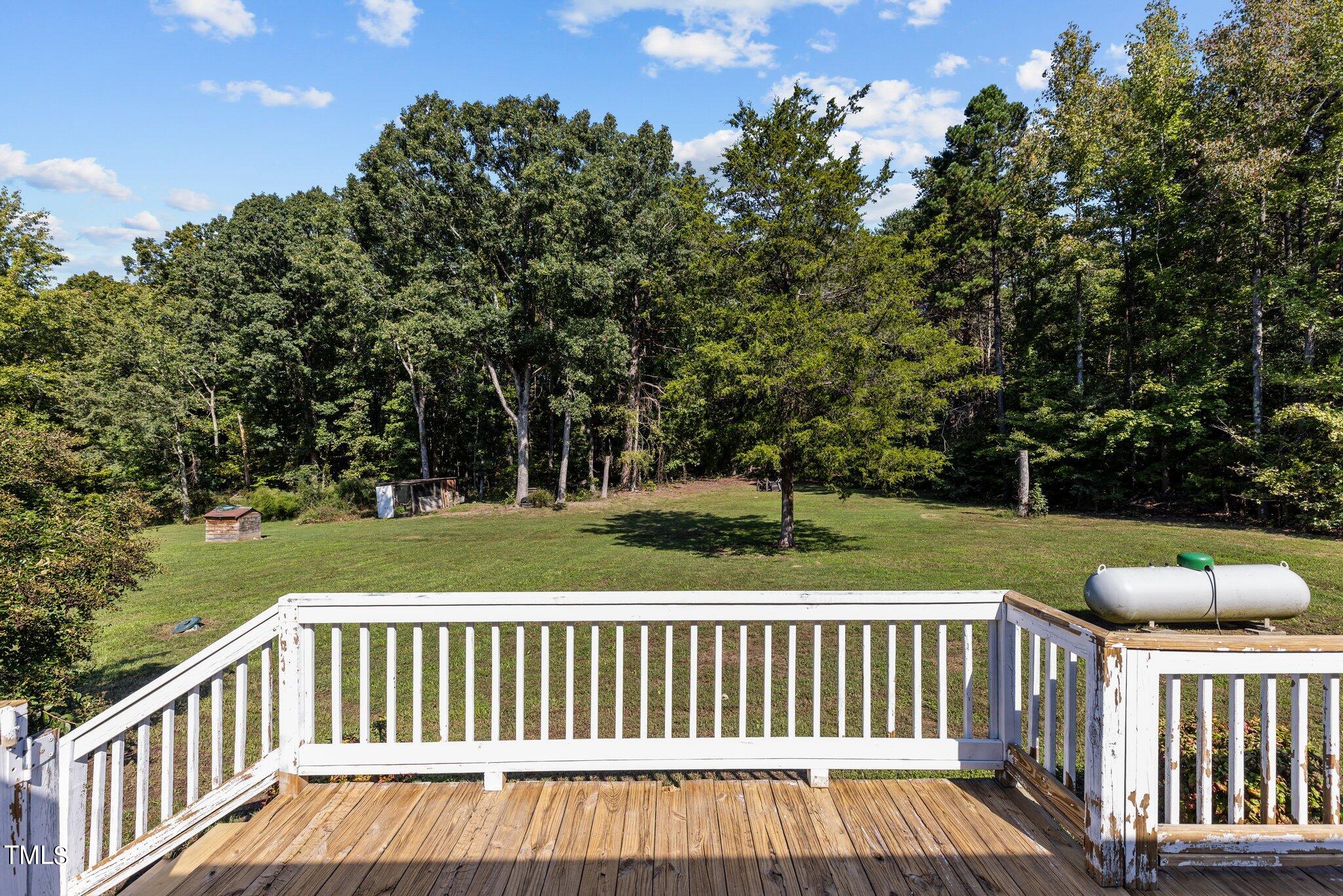 89 Munday Road Roxboro, NC 27574 - Photo 24 of 46 a view of balcony with wooden floor and fence
