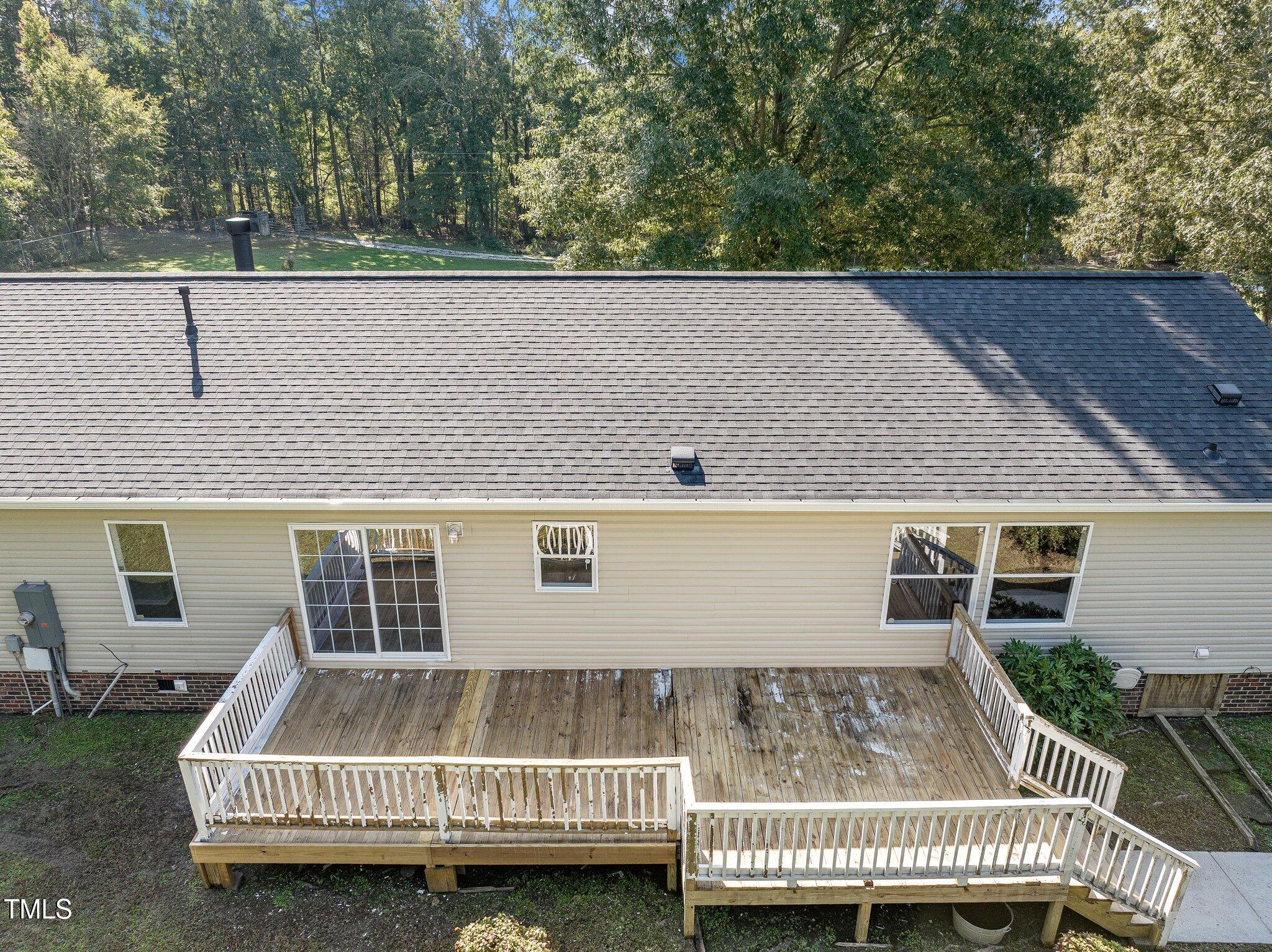 89 Munday Road Roxboro, NC 27574 - Photo 28 of 46 a view of house with roof deck and couches