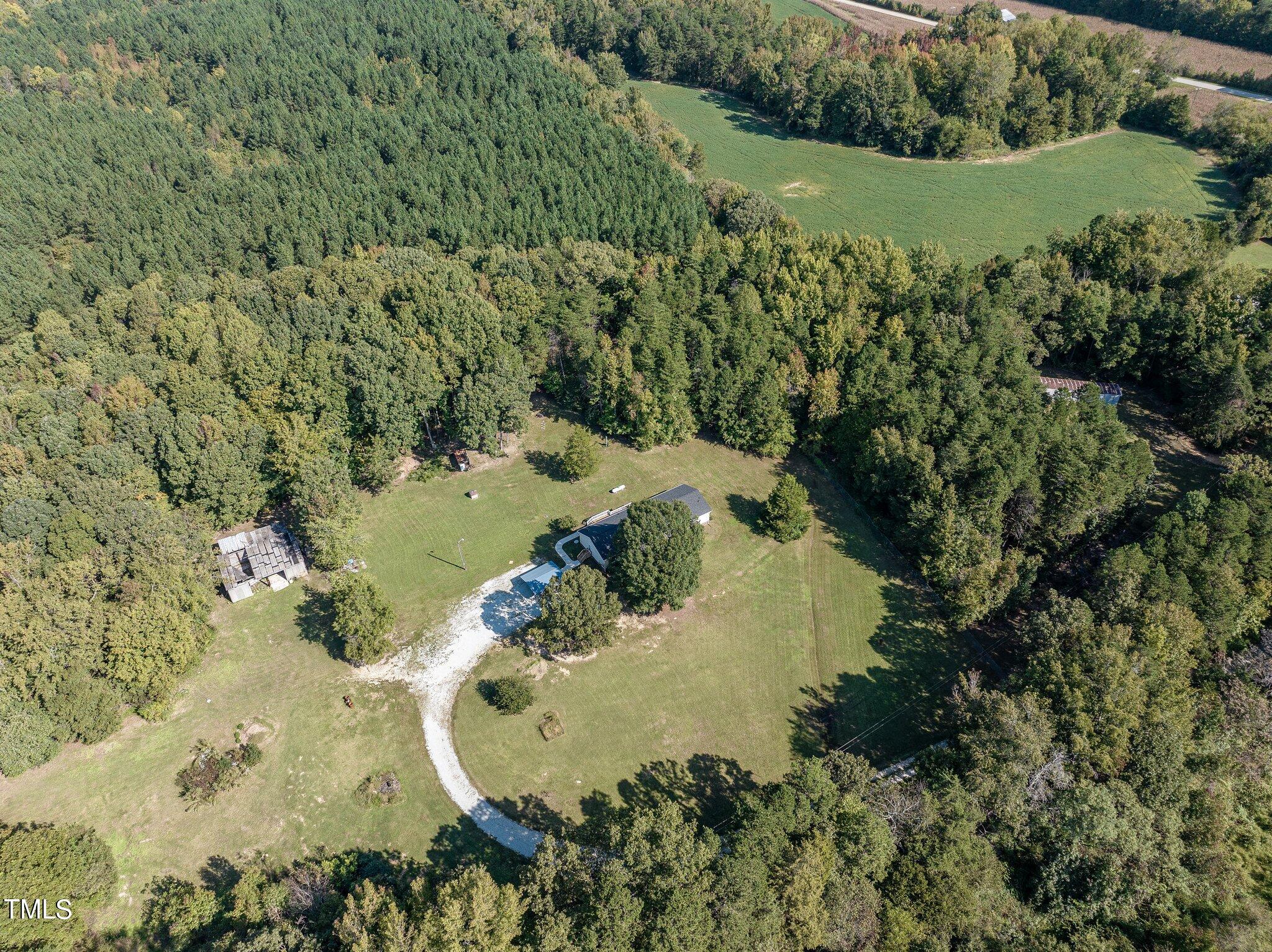 89 Munday Road Roxboro, NC 27574 - Photo 31 of 46 a view of a lake with a yard