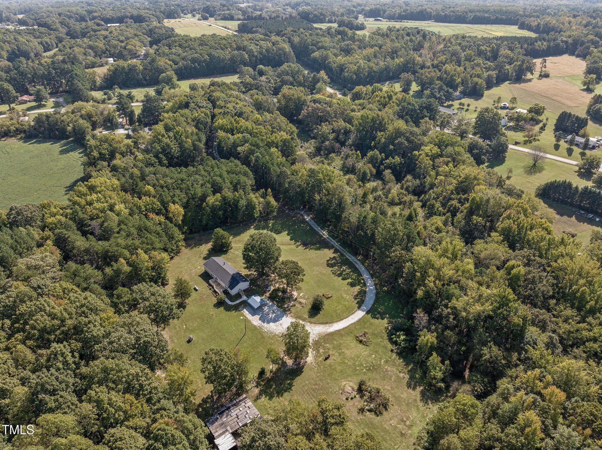 89 Munday Road Roxboro, NC 27574 - Photo 33 of 46 a aerial view of a house with a yard