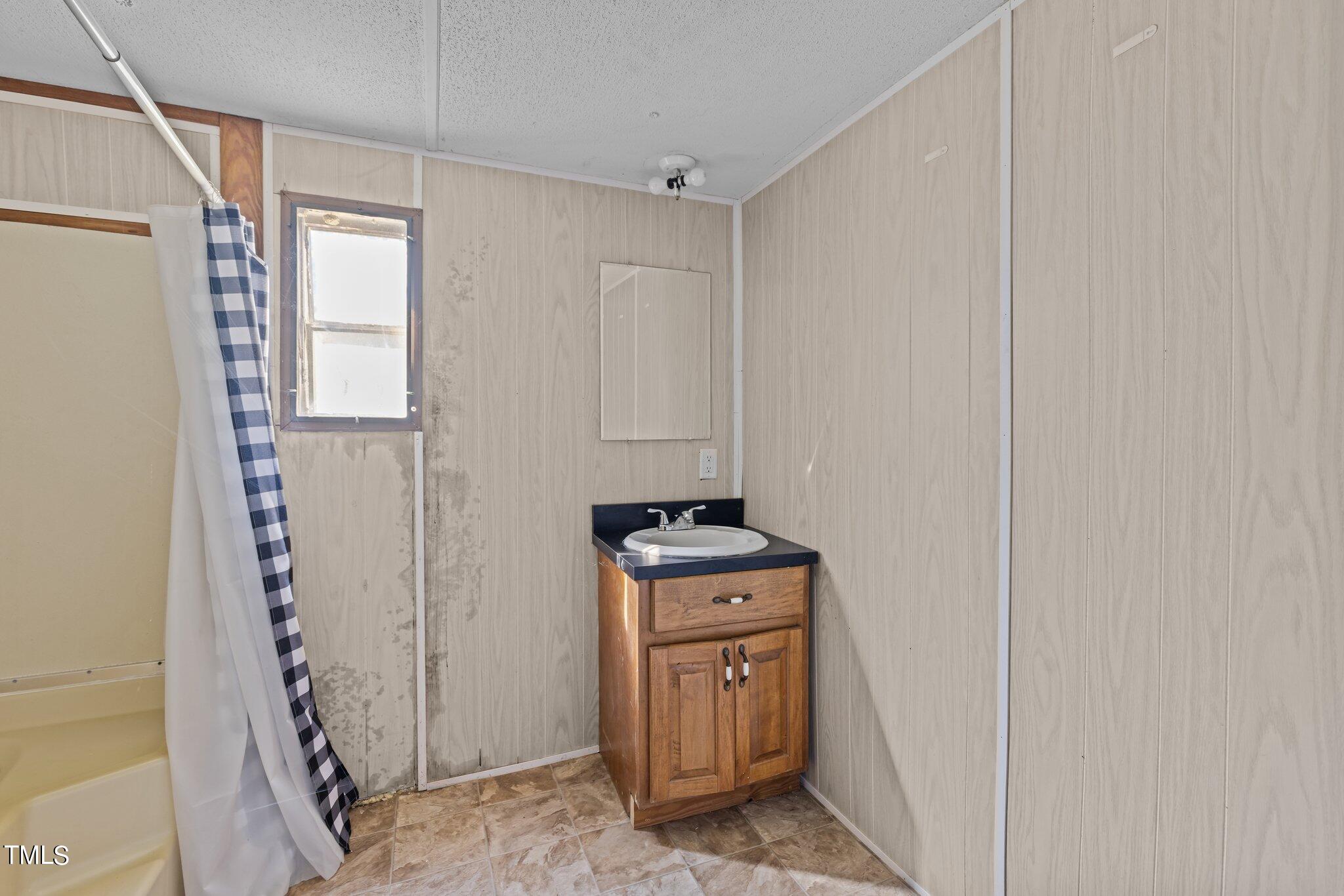 89 Munday Road Roxboro, NC 27574 - Photo 43 of 46 a room with storage and utility