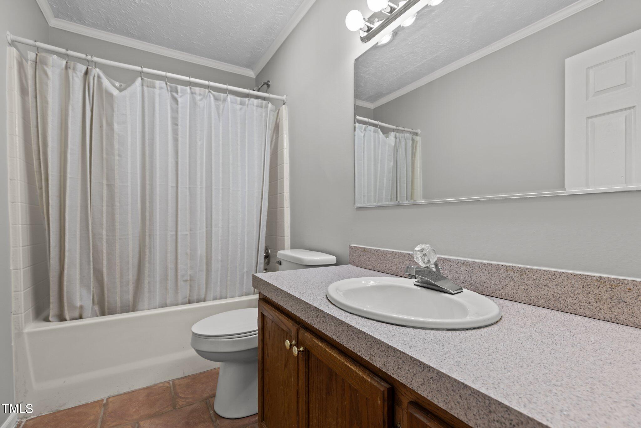 89 Munday Road Roxboro, NC 27574 - Photo 8 of 46 a bathroom with a sink toilet and shower