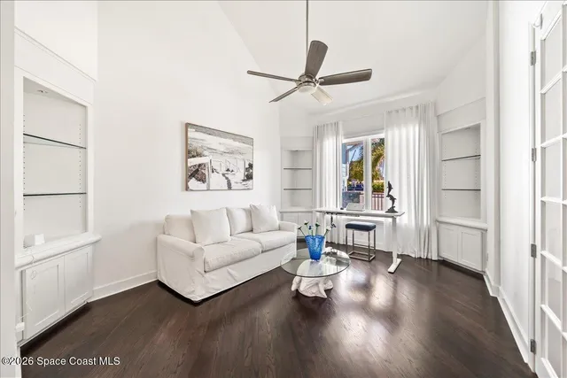 a view of a house with swimming pool and sitting area