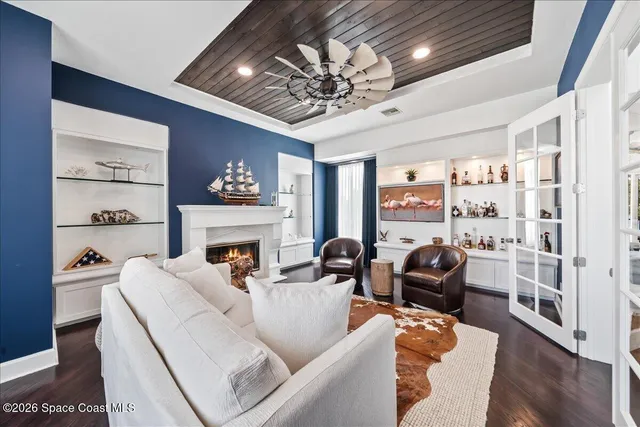 a view of a house with a big yard and potted plants