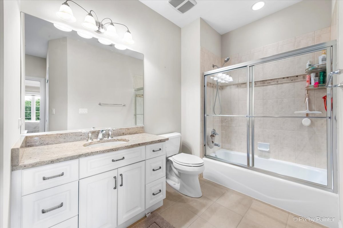 36W535 Hunters Gate Road St. Charles, IL 60175 - Photo 37 of 56 a spacious bathroom with a granite countertop sink toilet and shower