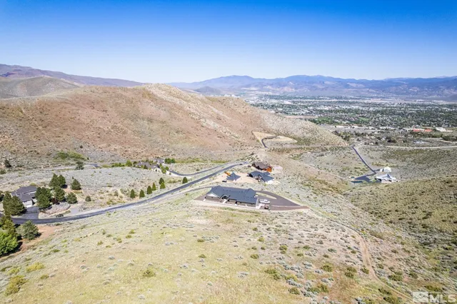 a view of a city and mountains in the background