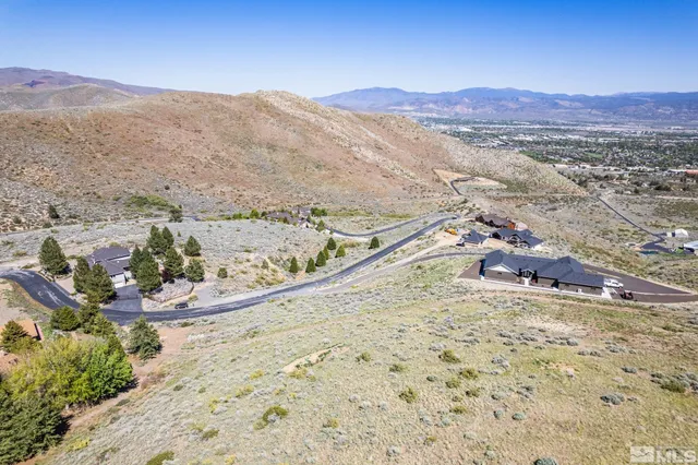 a view of a mountain with a mountain and trees
