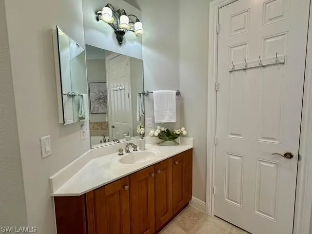 a bathroom with a double vanity sink and a mirror