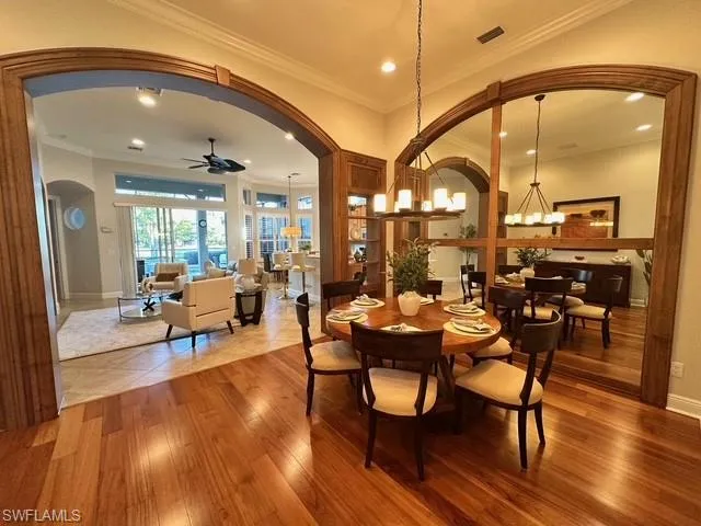 a living room with lots of furniture and a large window
