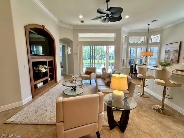 a living room with furniture a window and a fireplace
