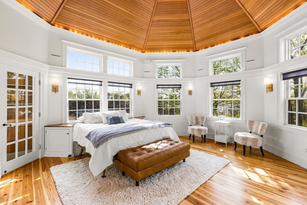 1 R Bailey's Island Road Scituate, MA 02066 - Photo 25 of 42 a spacious bedroom with a bed a table and chair