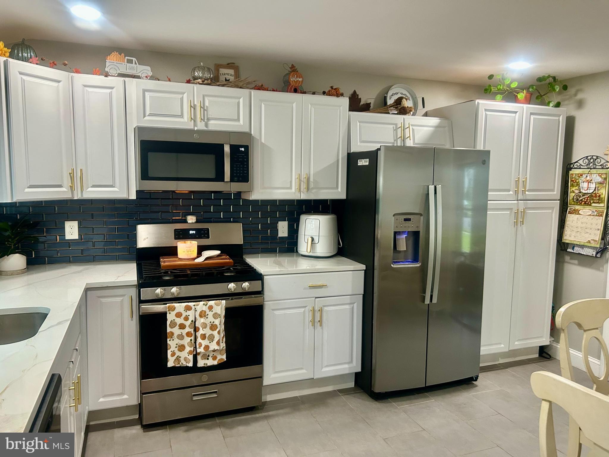 22 Bettlewood Road Marlton, NJ 08053 - Photo 4 of 15 a kitchen with stainless steel appliances granite countertop a refrigerator stove and microwave