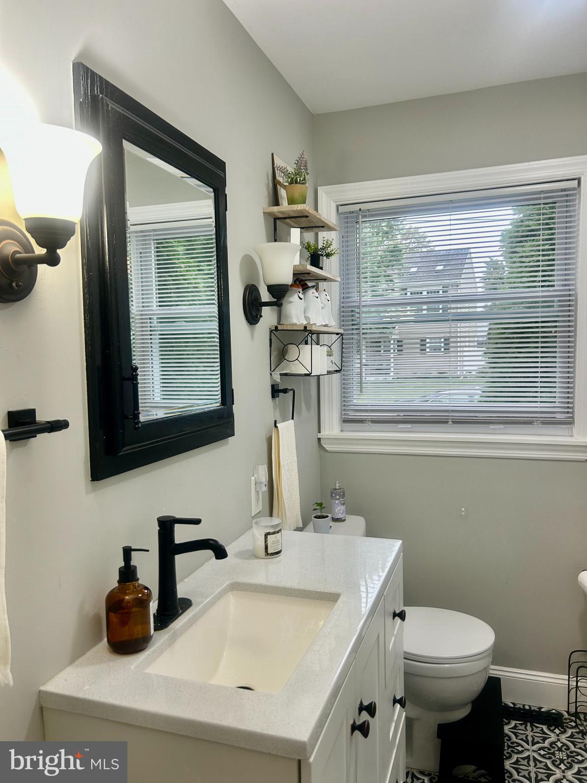 22 Bettlewood Road Marlton, NJ 08053 - Photo 7 of 15 a bathroom with a sink a toilet and a mirror