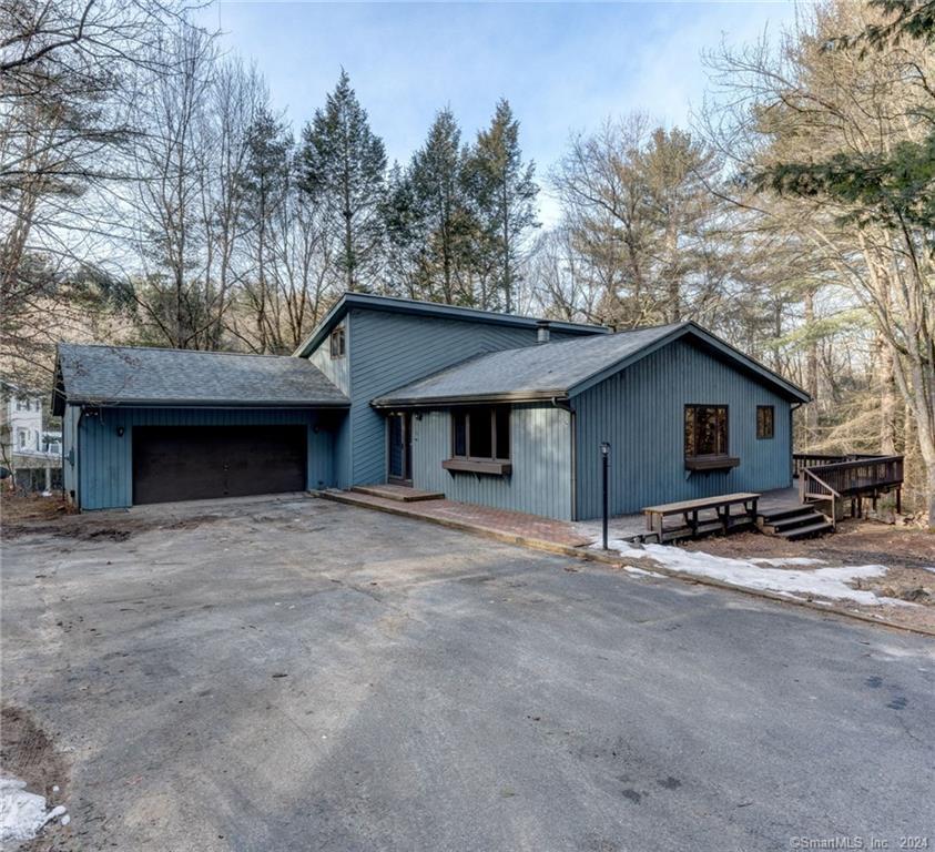 91 Lair Road New Hartford, CT 06057 - Photo 1 of 1 a house with trees in the background
