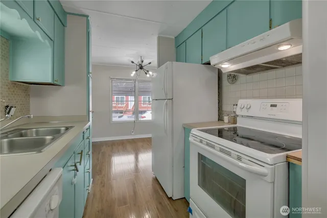 a kitchen with a stove and a sink
