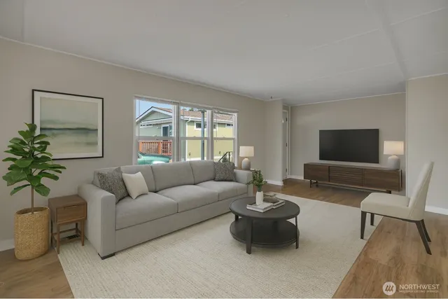 a living room with furniture and a flat screen tv