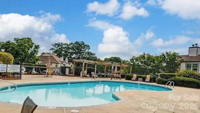 a view of a swimming pool with a patio