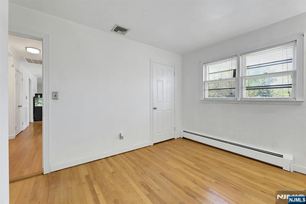 20 Blue Hill Road Norwood, NJ 07648 - Photo 25 of 49 a view of empty room with wooden floor and fan