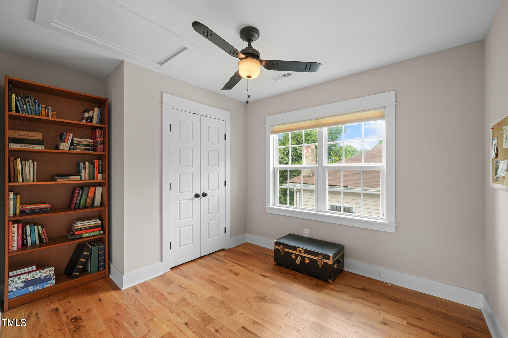 610 Gray Avenue Durham, NC 27701 - Photo 27 of 42 a bedroom with furniture and a book shelf