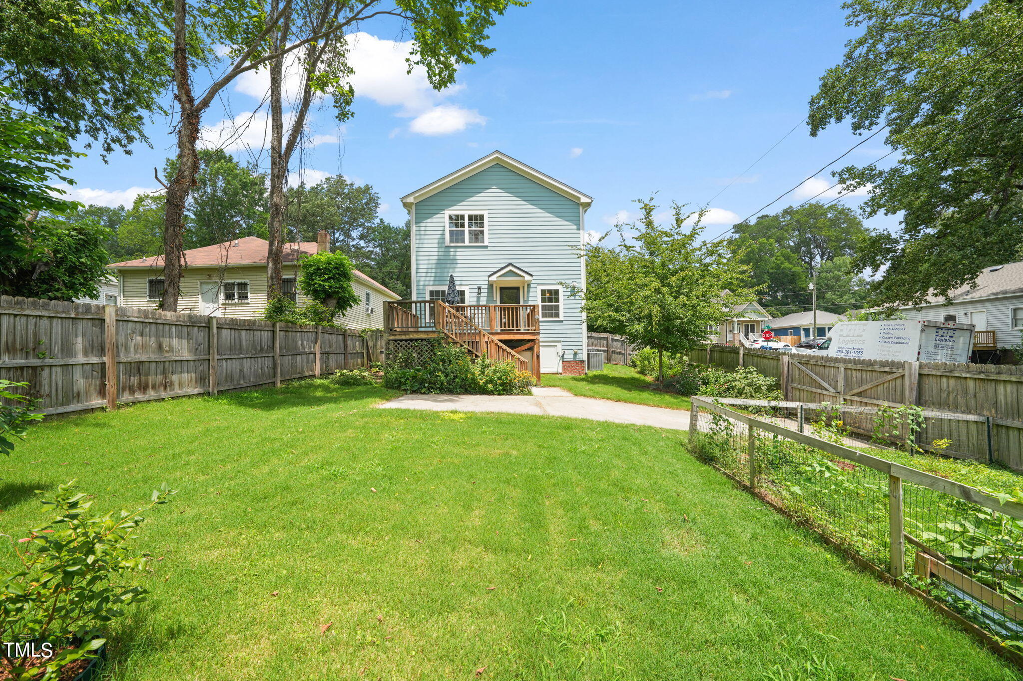 610 Gray Avenue Durham, NC 27701 - Photo 3 of 42 a view of a house with a big yard and large trees