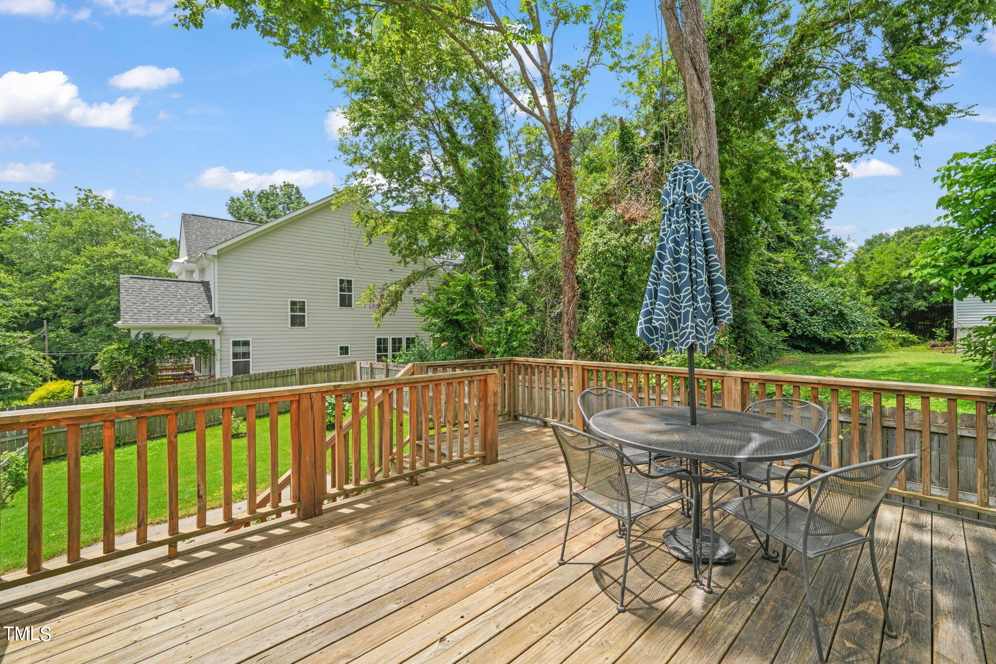 610 Gray Avenue Durham, NC 27701 - Photo 35 of 42 a view of balcony with wooden floor and outdoor seating