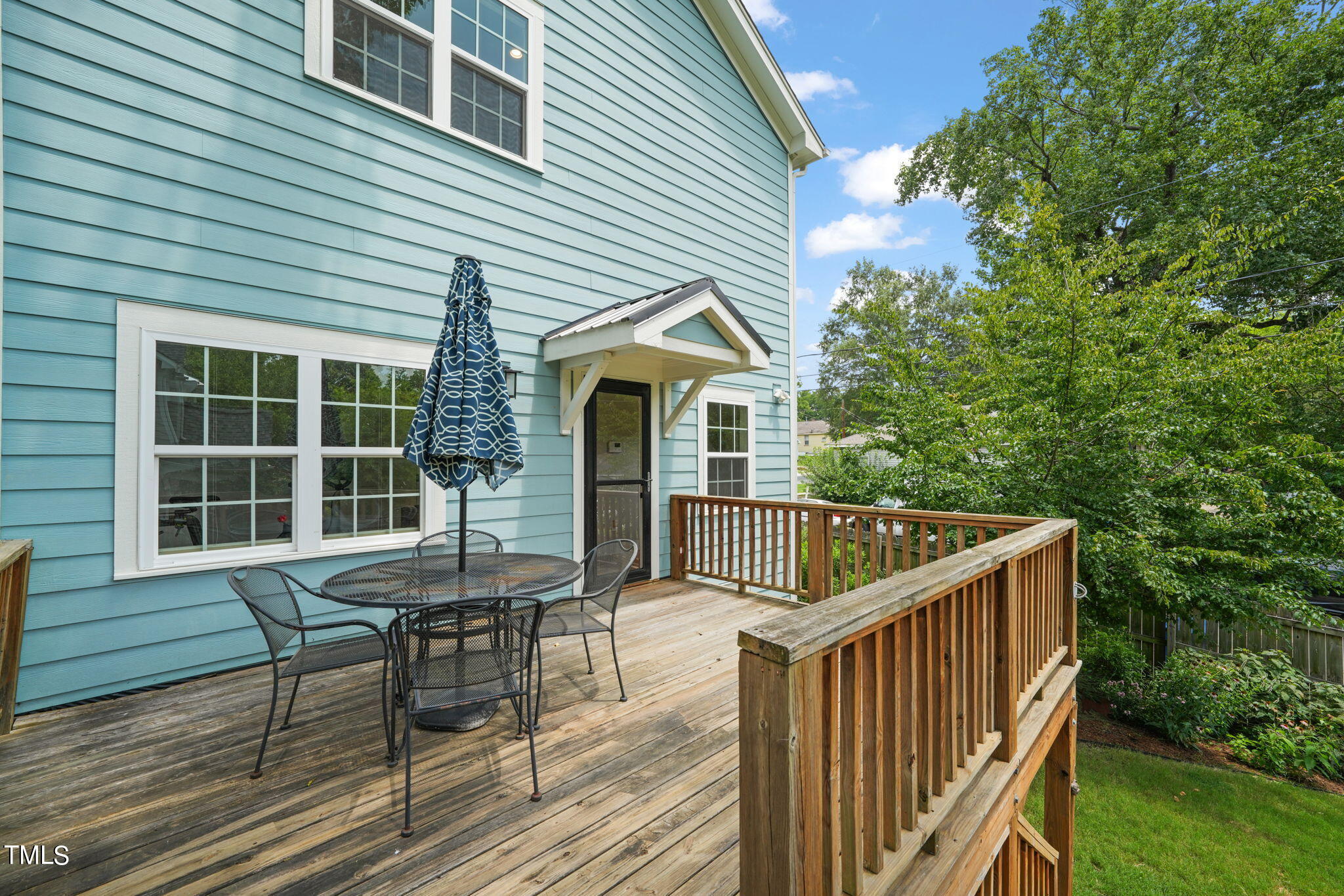 610 Gray Avenue Durham, NC 27701 - Photo 36 of 42 a view of house with deck and outdoor seating