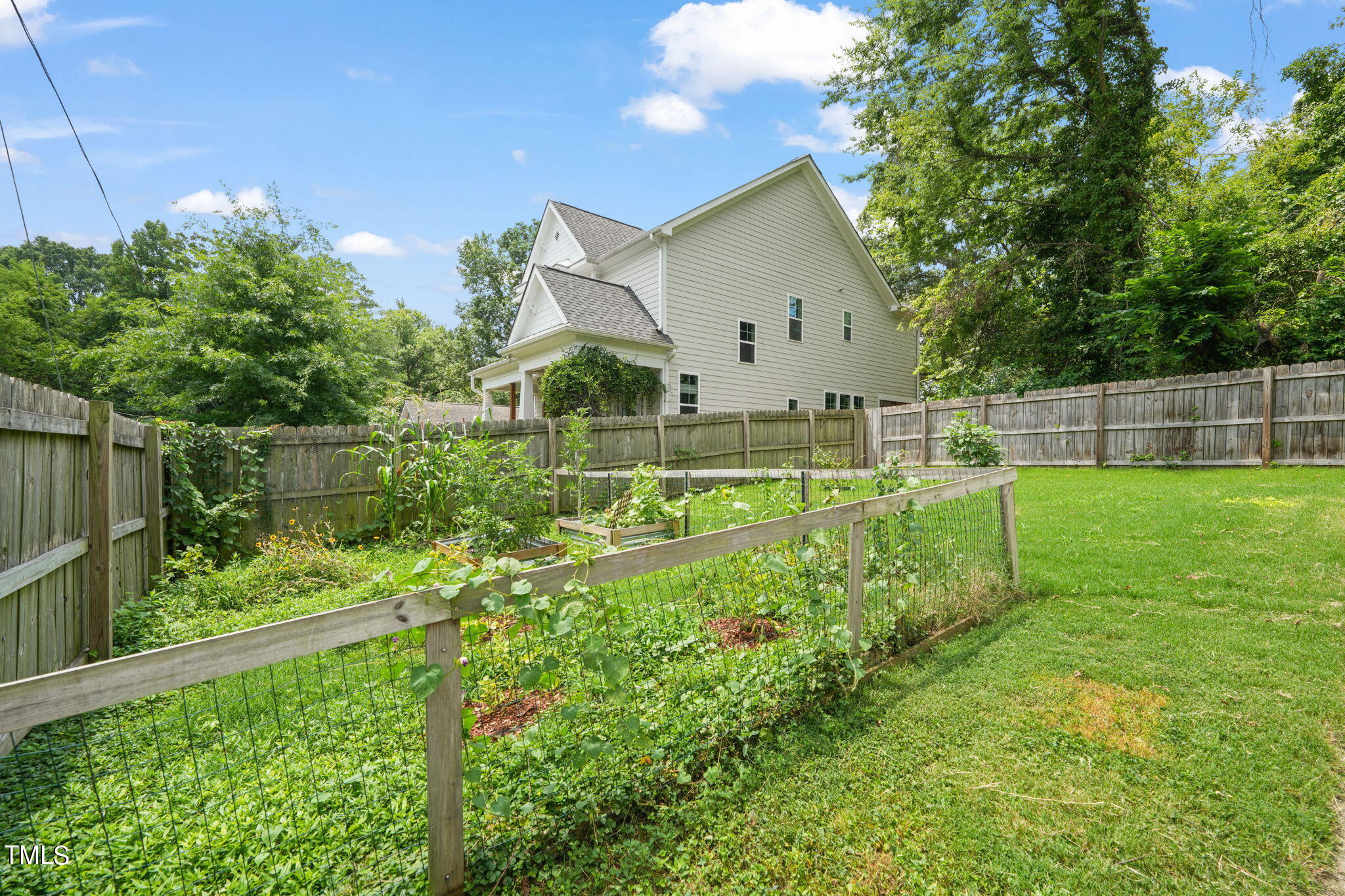 610 Gray Avenue Durham, NC 27701 - Photo 38 of 42 a view of a house with a yard and sitting area