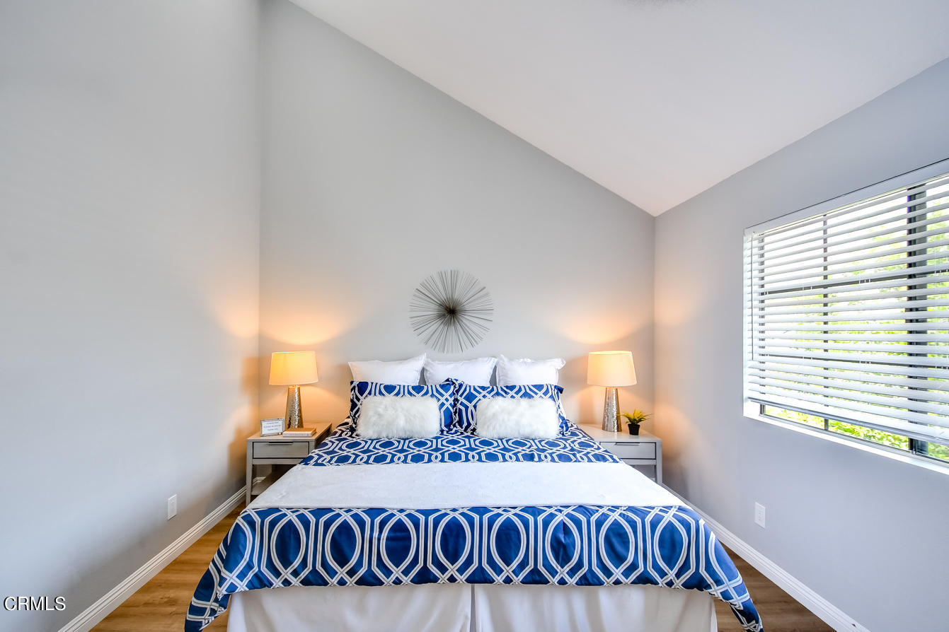 249 Alpine Street, Unit 53 Pasadena, CA 91106 - Photo 20 of 33 a bedroom with a bed and window