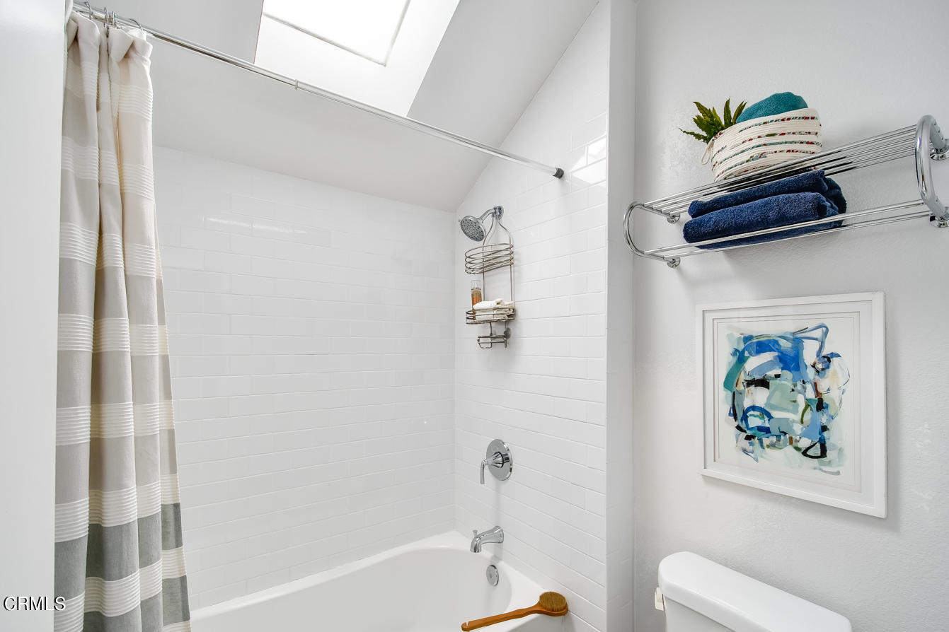 249 Alpine Street, Unit 53 Pasadena, CA 91106 - Photo 23 of 33 a bathroom with a bathtub and a shower