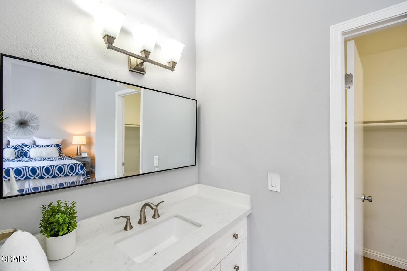 249 Alpine Street, Unit 53 Pasadena, CA 91106 - Photo 24 of 33 a bathroom with a sink and a mirror