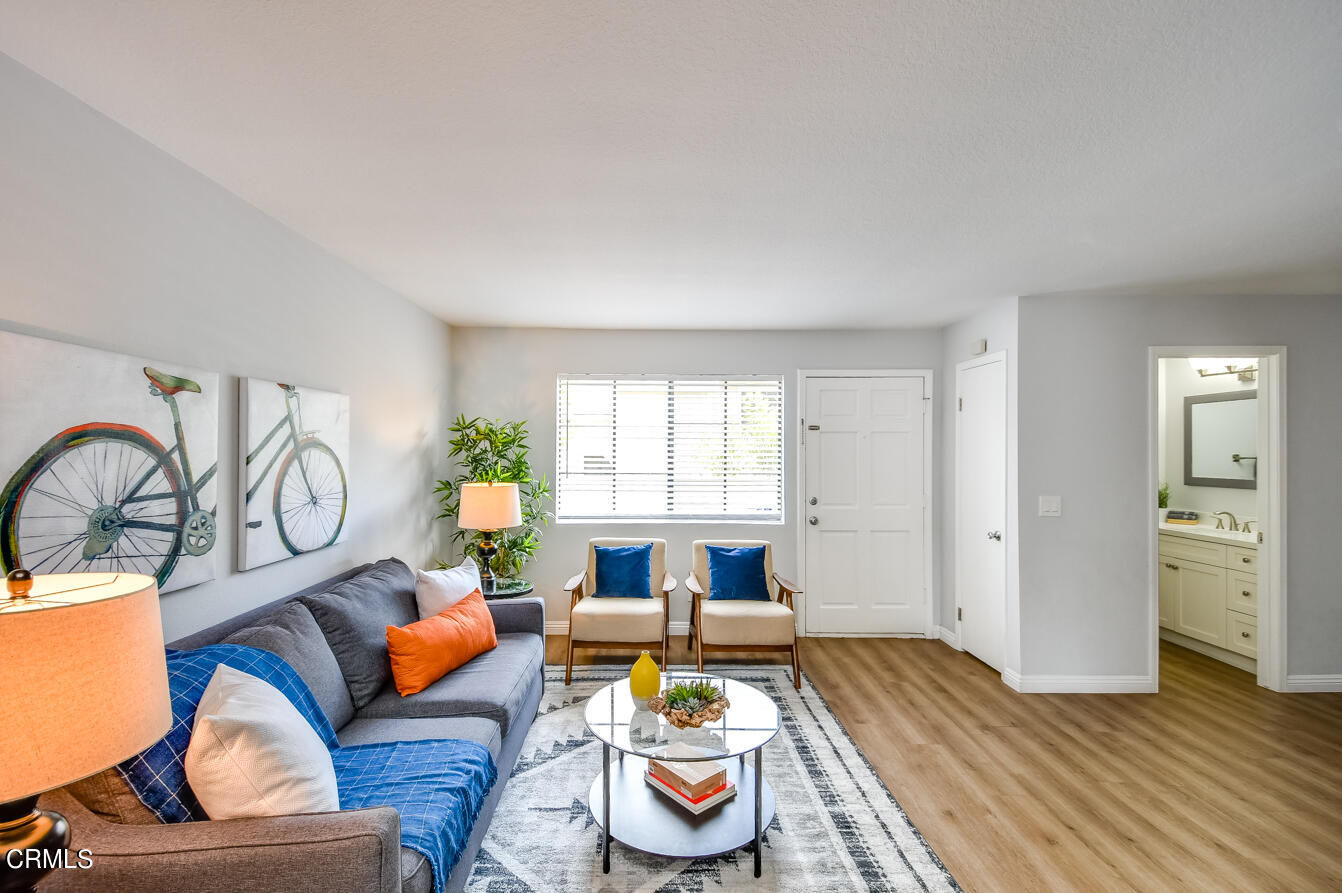 249 Alpine Street, Unit 53 Pasadena, CA 91106 - Photo 5 of 33 a living room with furniture and a wooden floor