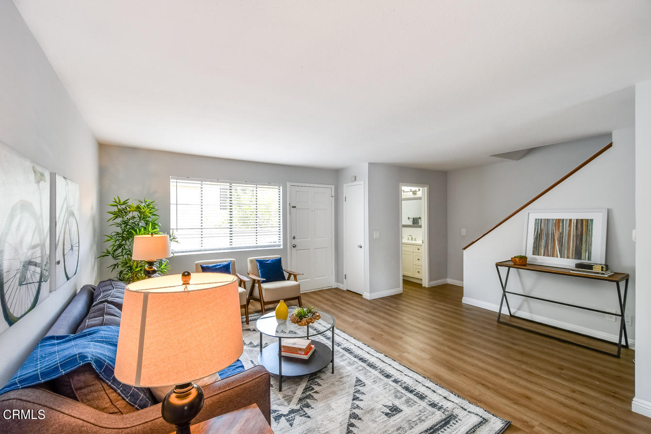 249 Alpine Street, Unit 53 Pasadena, CA 91106 - Photo 7 of 33 a living room with furniture and a wooden floor