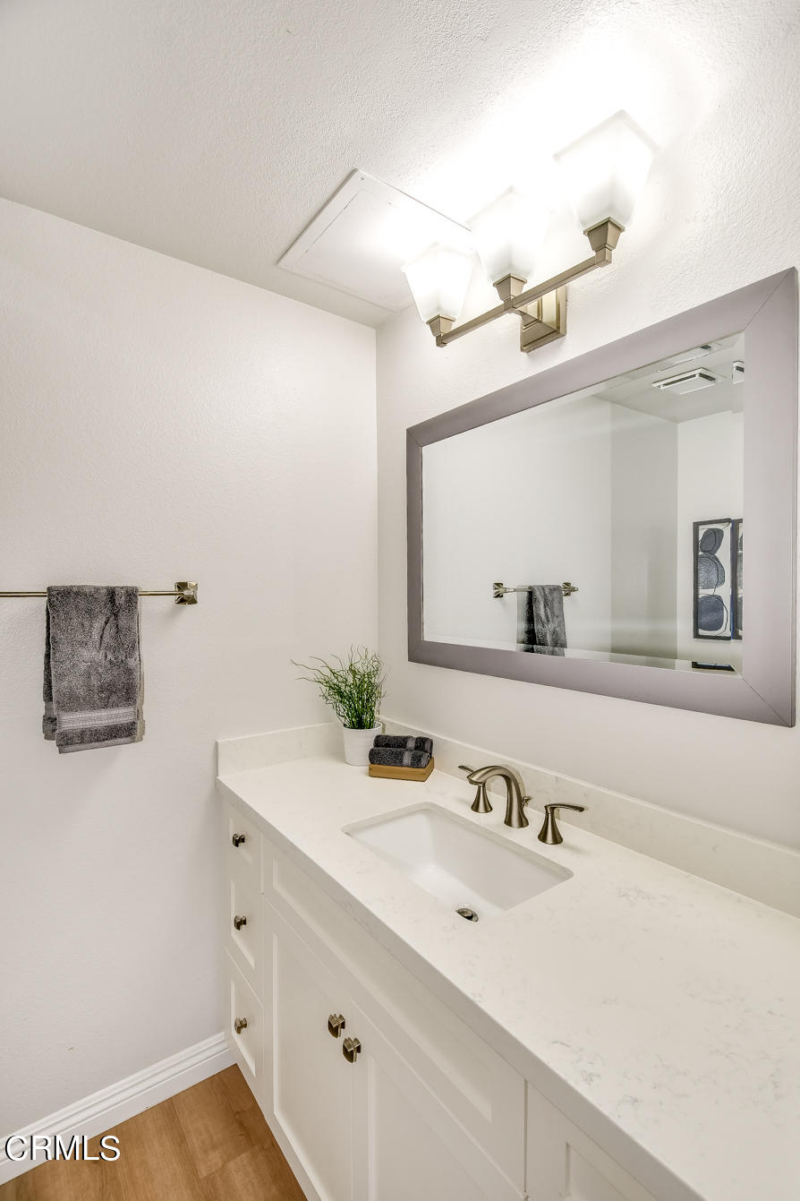 249 Alpine Street, Unit 53 Pasadena, CA 91106 - Photo 8 of 33 a bathroom with a sink and a mirror