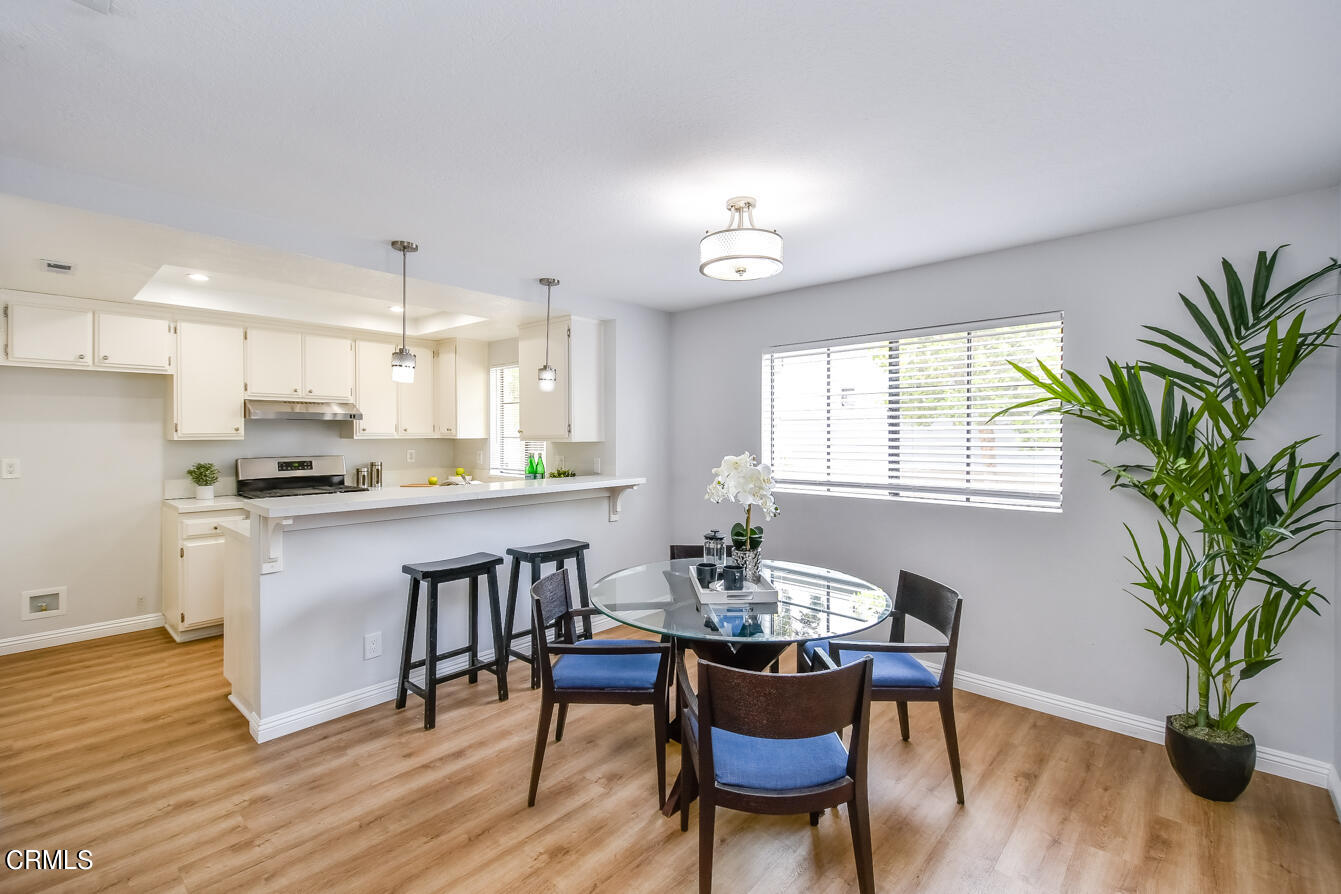 249 Alpine Street, Unit 53 Pasadena, CA 91106 - Photo 10 of 33 a kitchen with a table and chairs in it