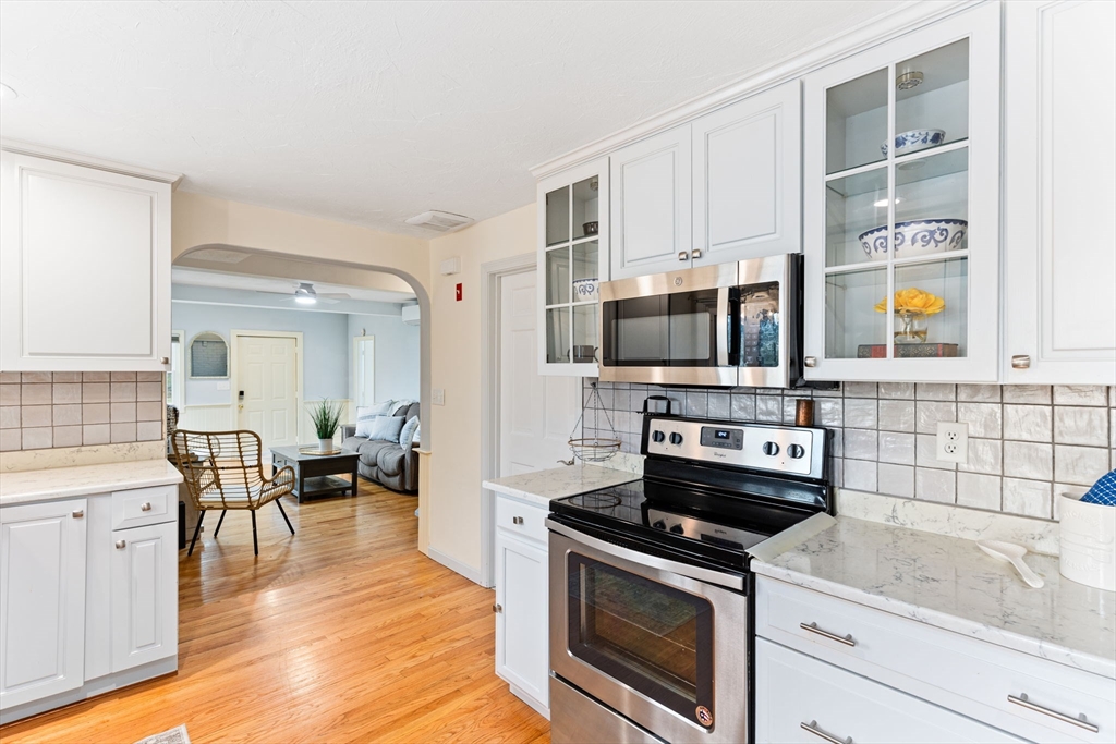 17 Weaver Street Wareham, MA 02576 - Photo 12 of 37 a kitchen with stainless steel appliances a stove a sink and a microwave