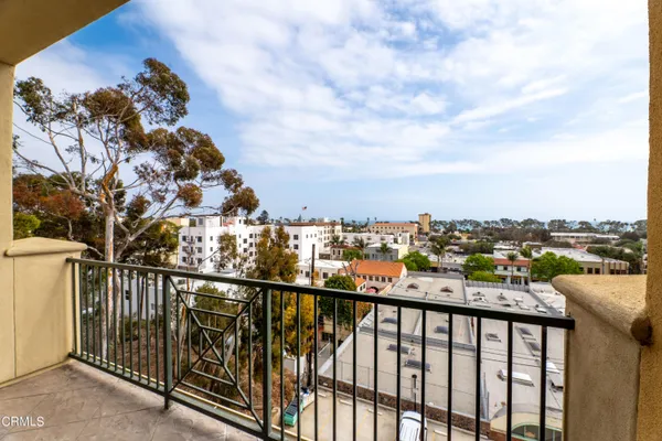 a view of a balcony with city view