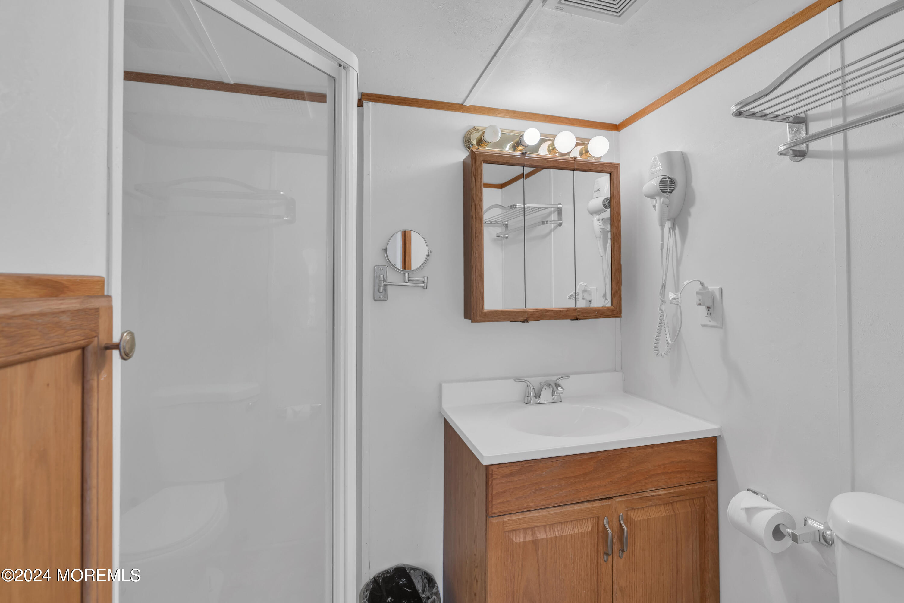 724 Monmouth Road, Unit 40 Cream Ridge, NJ 08514 - Photo 15 of 33 a bathroom with a sink toilet and shower
