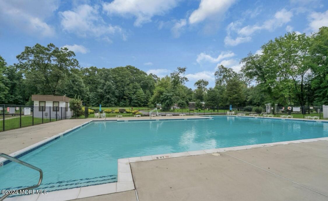 724 Monmouth Road, Unit 40 Cream Ridge, NJ 08514 - Photo 26 of 33 a view of a lake with a yard